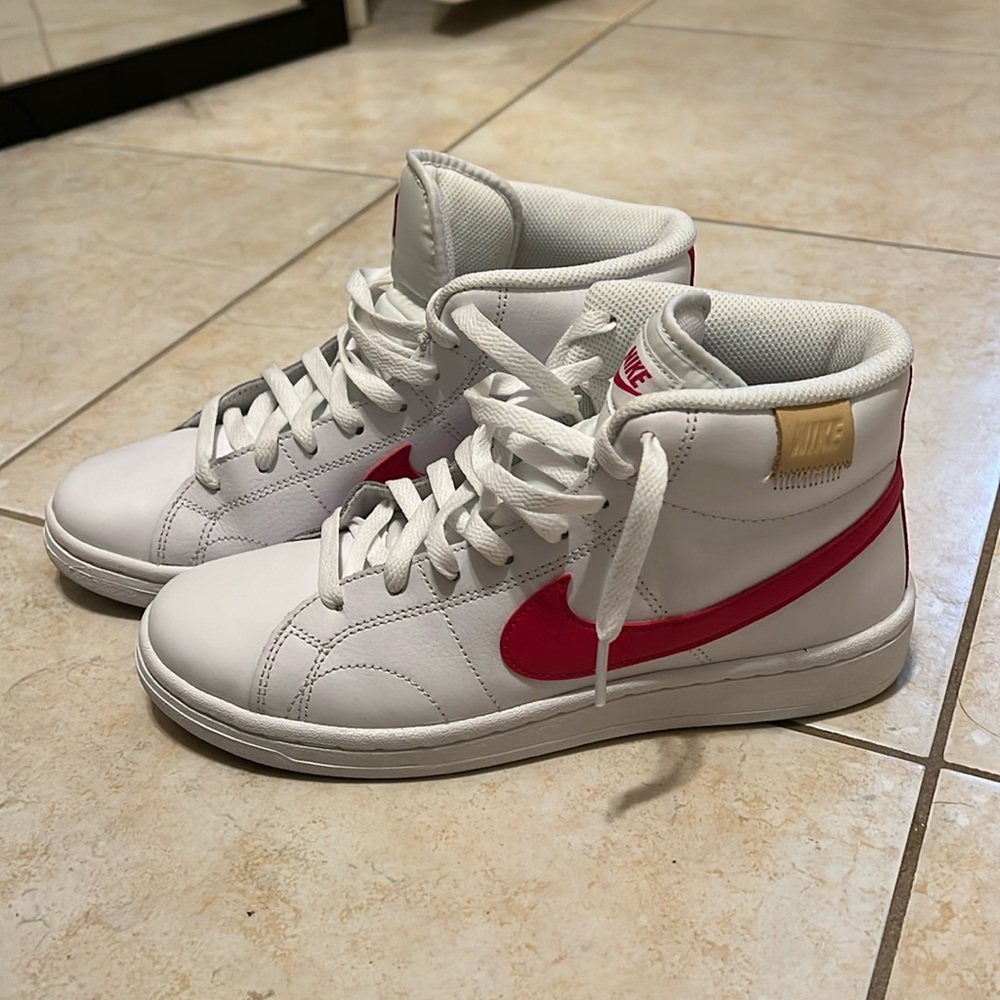 White and pink high top Nikes